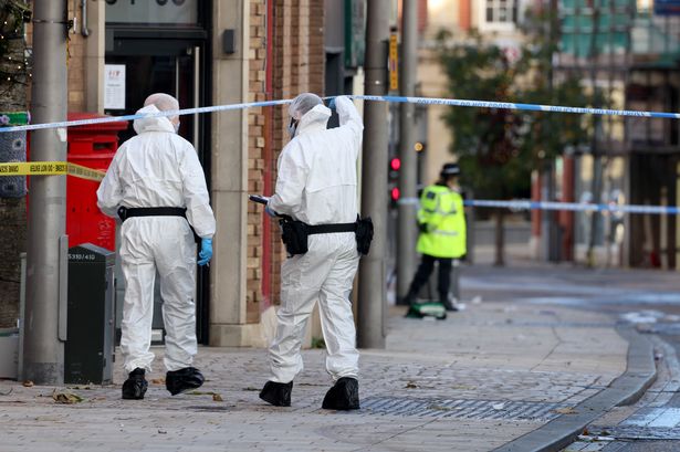 Police and forensic officers on the scene in Altrincham