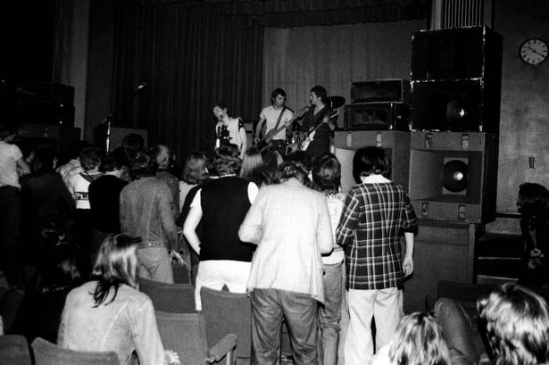 The Sex Pistols performing on stage at the Free Trade Hall in June 1976