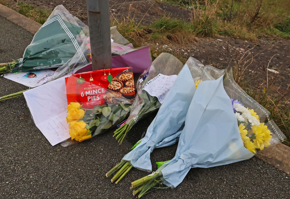 Tributes at the scene on Marine Drive in Southport included flowers and a packet of mince pies, left by Simon's sister Kim