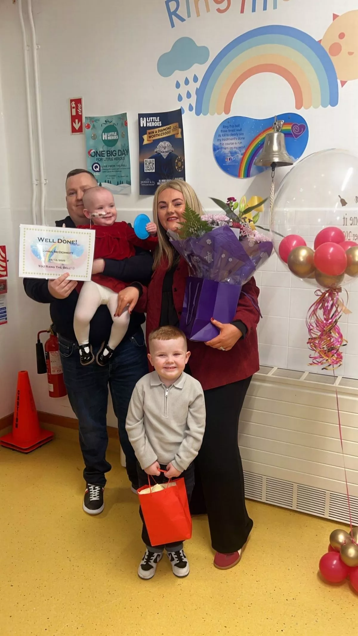 The McDermott family celebrating Sophia ringing the bell
