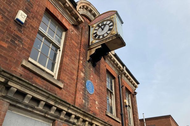 The frontage of the Queen Street house, which has been altered over time but still retains historic features inside. It has a blue plaque to commemorate both John Flamsteed and Joseph Wright living there