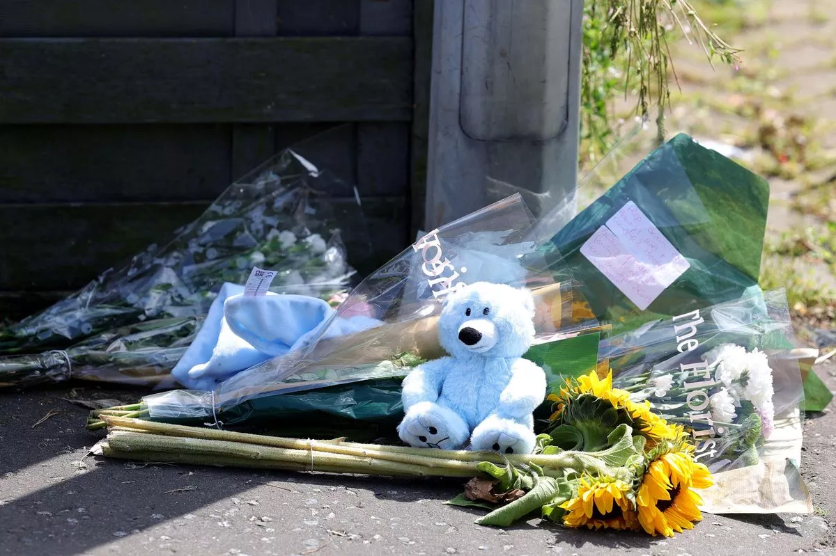Floral tributes left at the scene following the murder of Sarah Montgomery at her home in Donaghadee, Co Down in June 2025