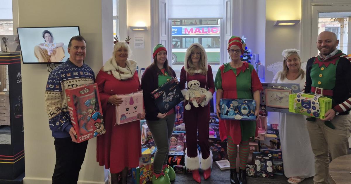 Musselburgh opticians donate over £700 of toys at Christmas