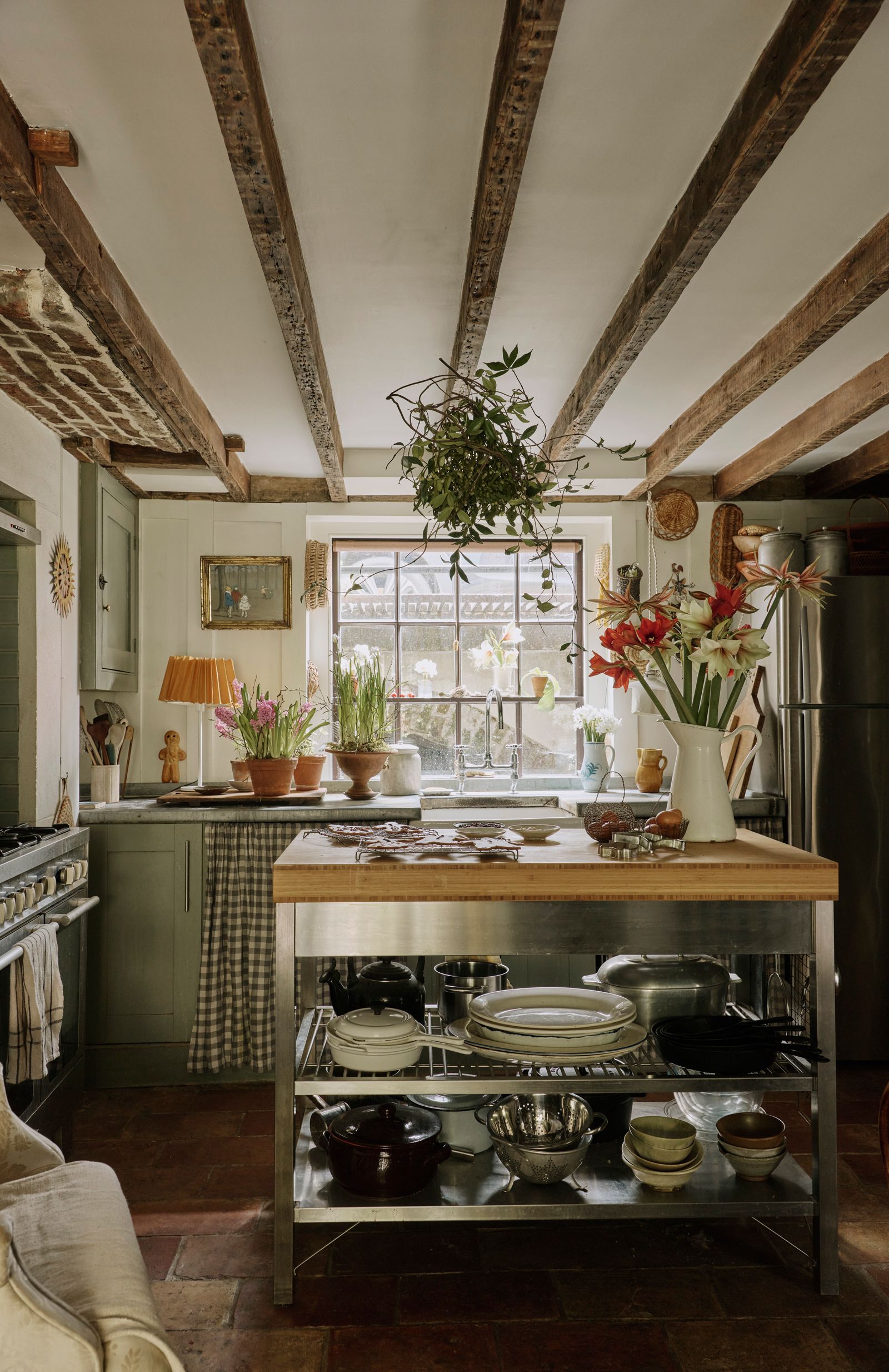 Image may contain Indoors Interior Design Kitchen Plant Person Art Painting and Flower