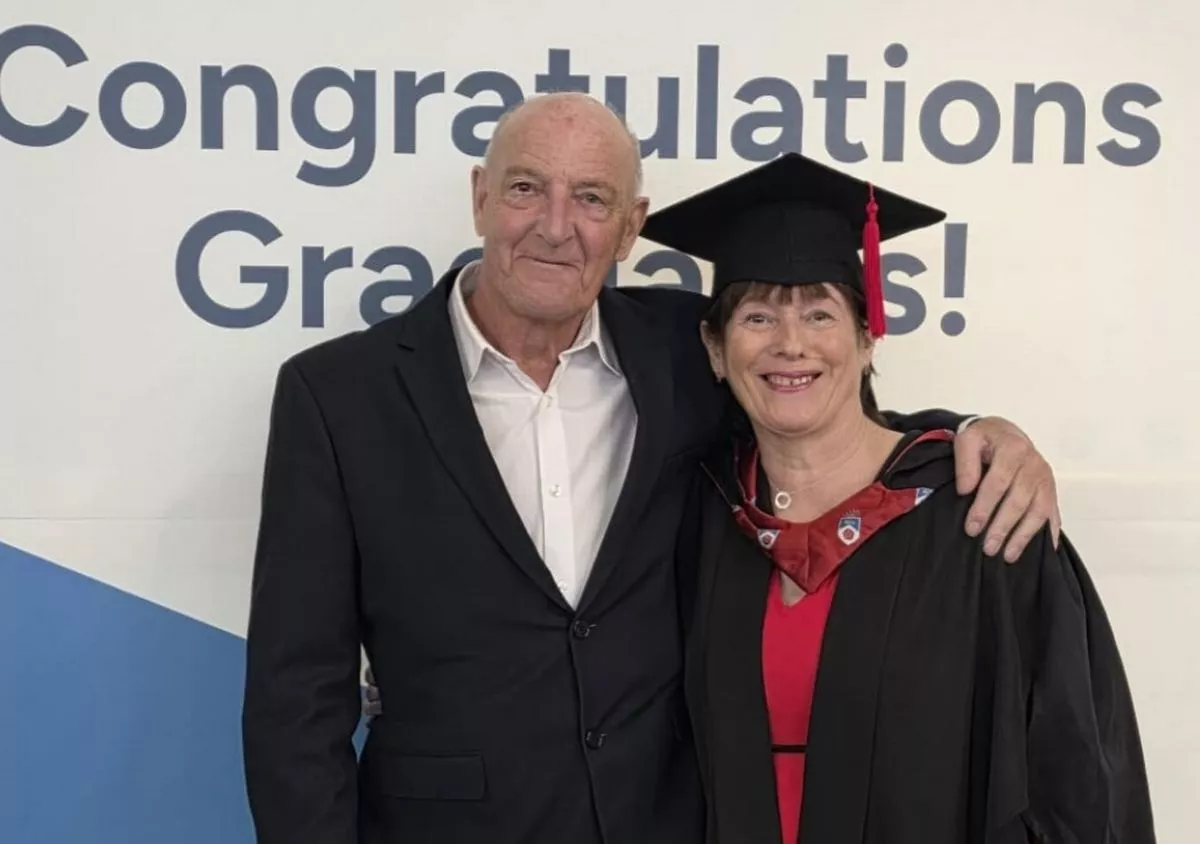 Jean pictured at her graduation with her partner Dave.