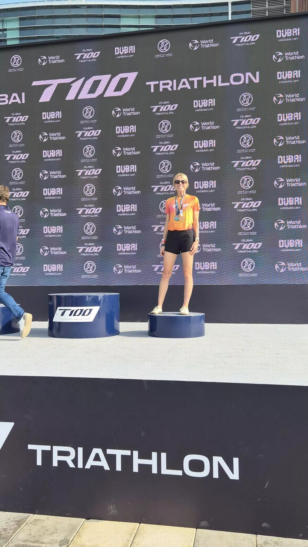 Genevieve Thueux on the podium in third place at the Dubai Triathlon 2025.