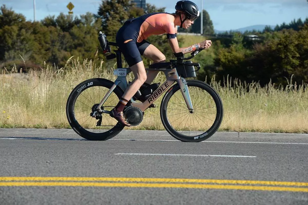 A woman cycling in a triathlon