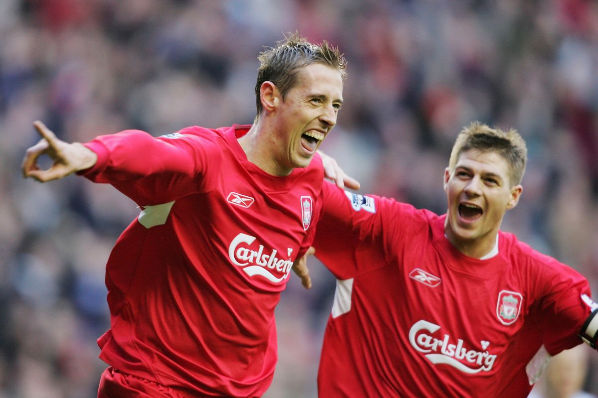 Peter Crouch (L) celebrates with Stephen Gerrard of Liverpool after he scores the second goal during the Barclays Premiership match between Liverpool and Wigan Athletic at Anfield on December 3, 2005 in Liverpool, England. 