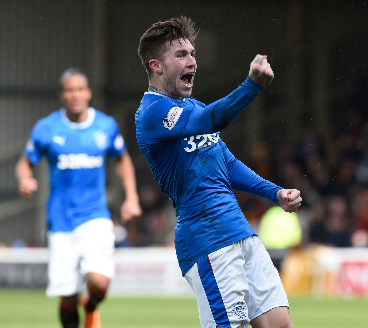 Josh Windass  celebrates for Rangers.