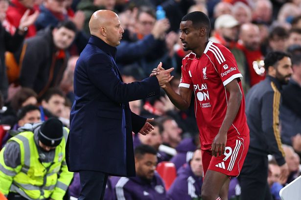 LIVERPOOL, ENGLAND - OCTOBER 19: Arne Slot manager / head coach of Liverpool and Alexander Isak of Liverpool during the Premier League match between Liverpool and Manchester United at Anfield on October 19, 2025 in Liverpool, England. (Photo by Robbie Jay Barratt - AMA/Getty Images)