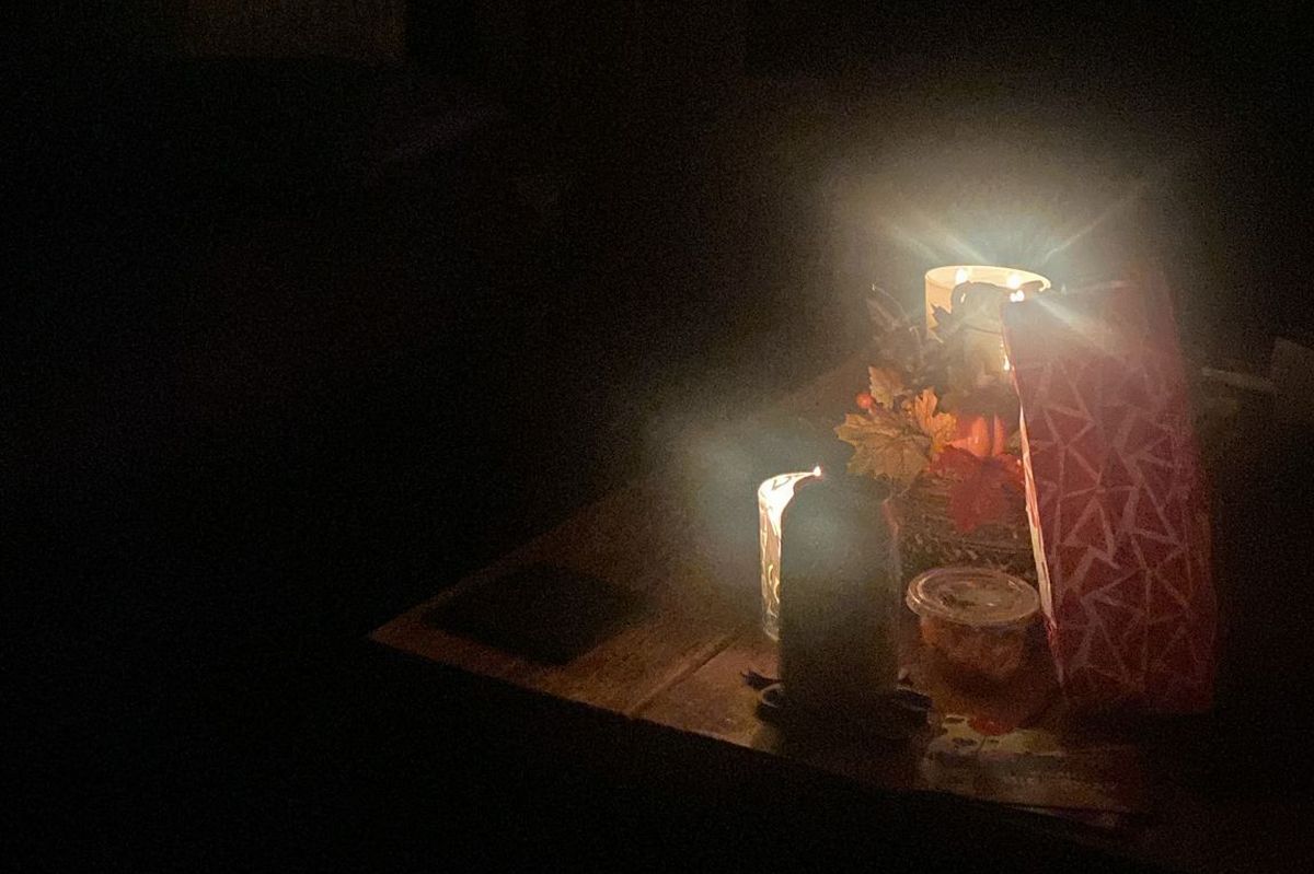 Residents sat around candles after around 65 homes were hit by the power cut