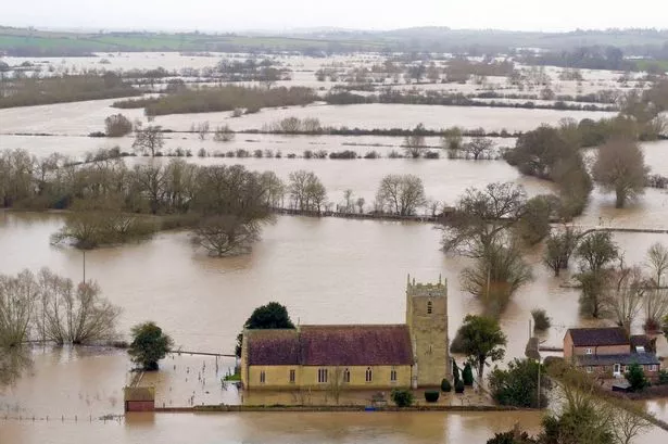 Flood water surrounds a church in Gloucestershire after previous wet weather (file image)