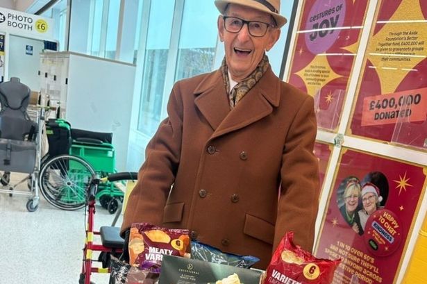 Owen looking delighted with his gifts at his local supermarket in Cwmbran.