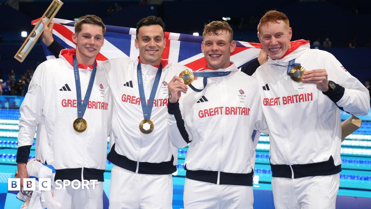 Great Britain's Duncan Scott, James Guy, Matthew Richards and Tom Dean pose with their gold medals