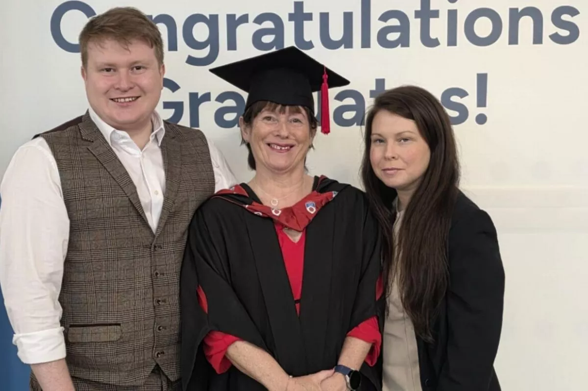 Jean pictured at her graduation with her son Sam and daughter Lucie.