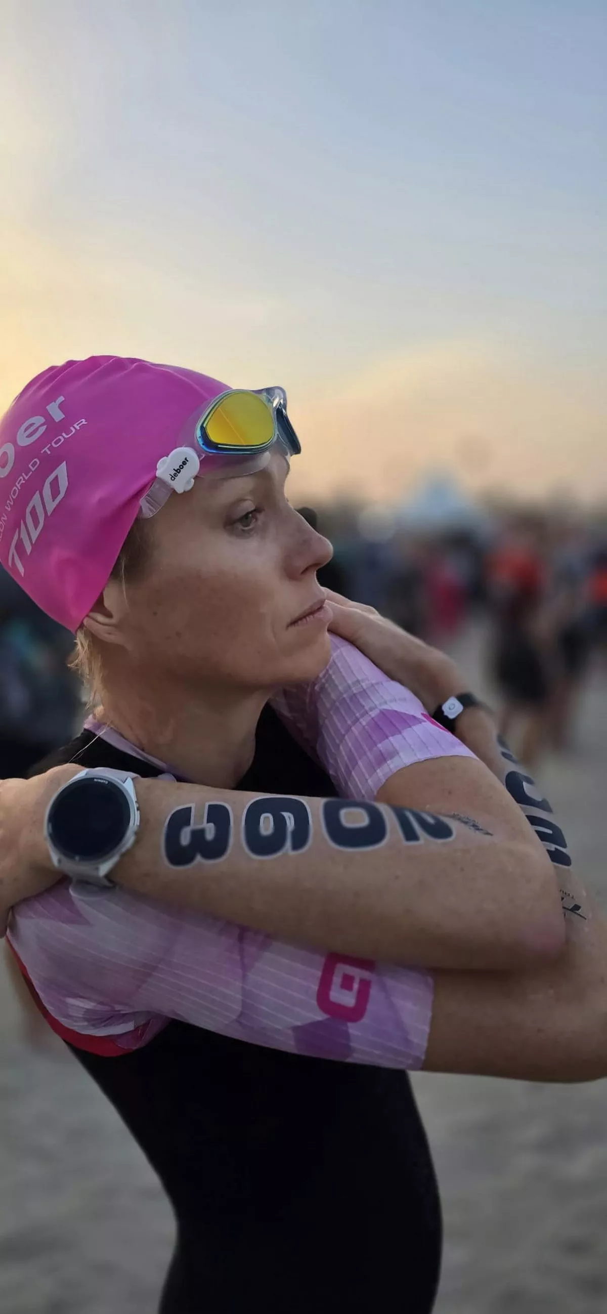 A woman gets ready to swim in a  triathlon