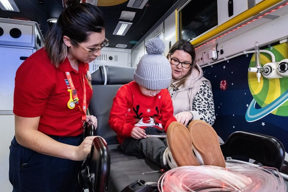 Reuben Kirkpatrick (5), who is one of the service users for Northern Ireland’s only bespoke children’s Ambulance, with his mum Roberta Donnelly and paediatric transport nurse Natasha Butler, at the Royal Belfast Hospital for Sick Children on 9th December 2025 (Luke Jervis/Belfast Telegraph)