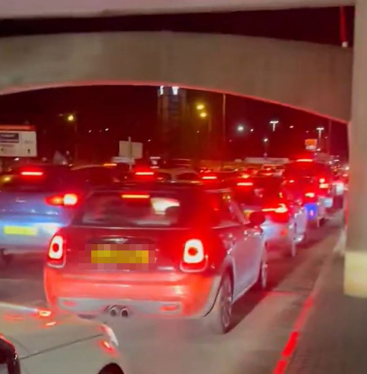 Long queues of cars to exit the multi-storey car park