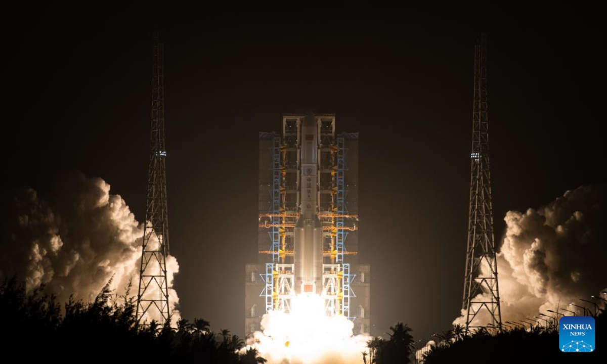 A Long March-5 rocket carrying a new communication technology test satellite blasts off from the Wenchang Space Launch Site in south China