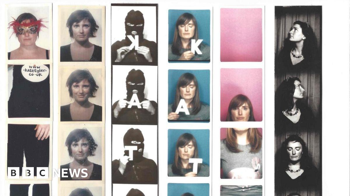 Six strips of images from a photo booth. Strip one shows a woman wearing black trousers and a black tank top. She has a feathered mask on her face. There is a sign that says www.katetyler.co.uk. The second strip has four images of a woman, with short brown hair. Each picture of her has a different facial expression. The third image has a person with a mask over their face. The images are in black and white and the person is holding letters K, A, T and E. The fourth strip has a woman with shoulder length hair and she is on a blue background. She is also holding the letters K, A, T, and E.  The fifth strip, the top image is a pink background, the second image is a woman's face cut off at the chin, the third image is a body wearing a grey top, and the last image is the continuation of the grey top. The last strip is black and white, with a woman wearing sunglasses on her head, facing different directions.