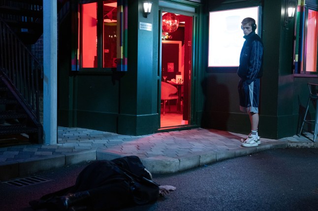 Oscar Branning discovering Cindy Beale, unconscious outside the Albert