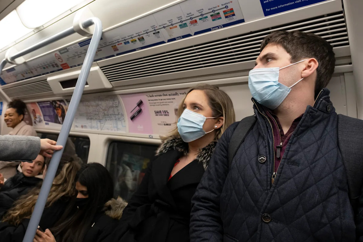 Wear masks in public to fight off 'tidal wave' of flu, NHS boss urges