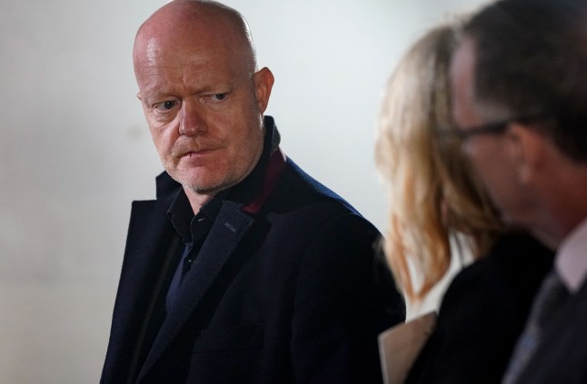 Max stands with Cindy and Ian in EastEnders