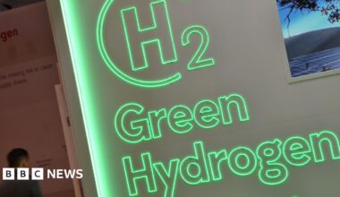 An electrolyser sits on a production line at Quest One's factory. It's rectangular in shape, about the size of a shopping basket with a metal grid around the outside.