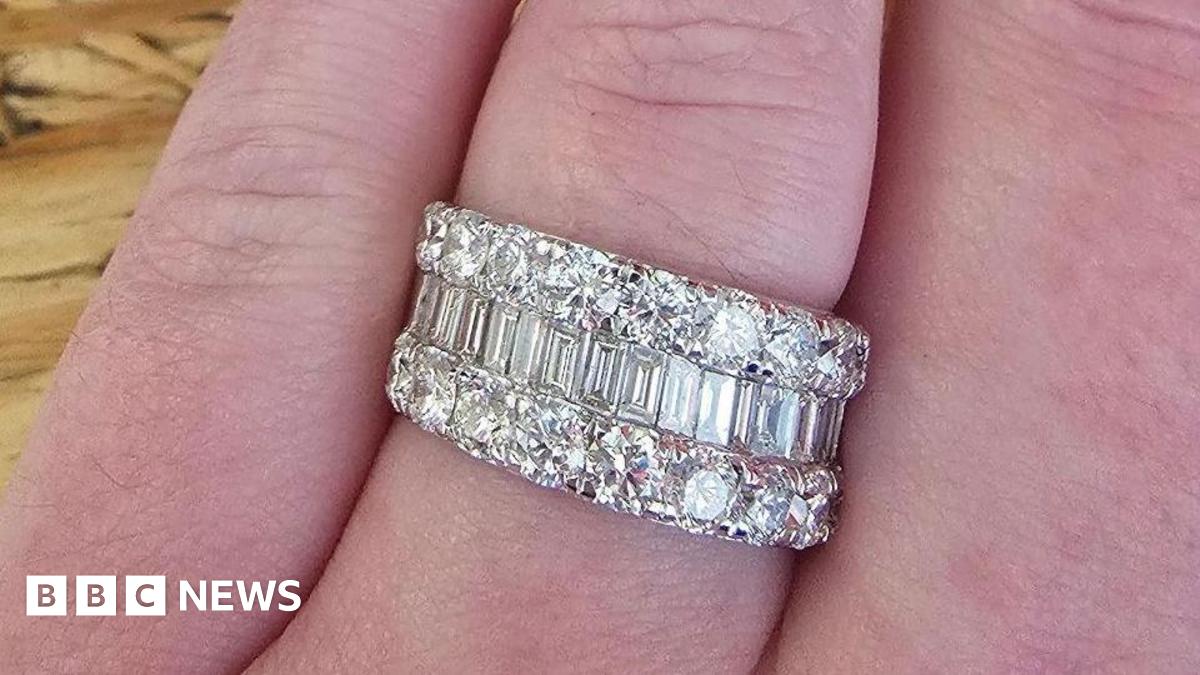 A picture of the ring that was stolen. It is a large ring with a number of diamonds in it and silver in colour.