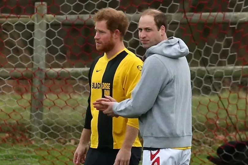 A younger Prince William and Prince Harry enjoy a Christmas Eve kickabout at Sandringham