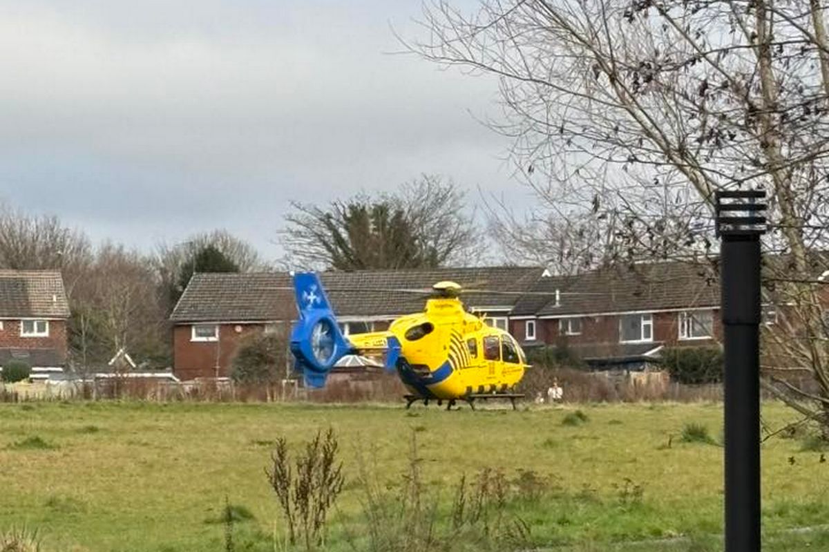 An air ambulance lands in Boothstown on Saturday