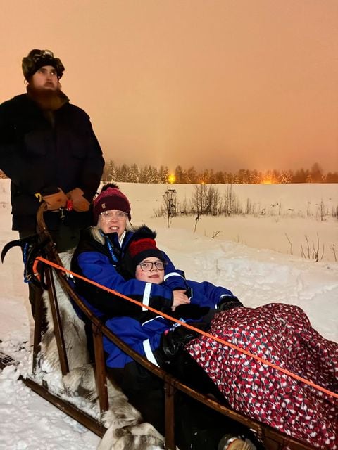 Lisa and Leo on a sled at Lapland