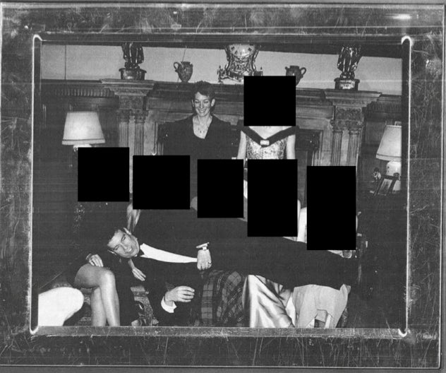 A photograph of ex-Prince Andrew lying on women's laps with Jeffrey Epstein associate Ghislaine Maxwell smiling in the background.