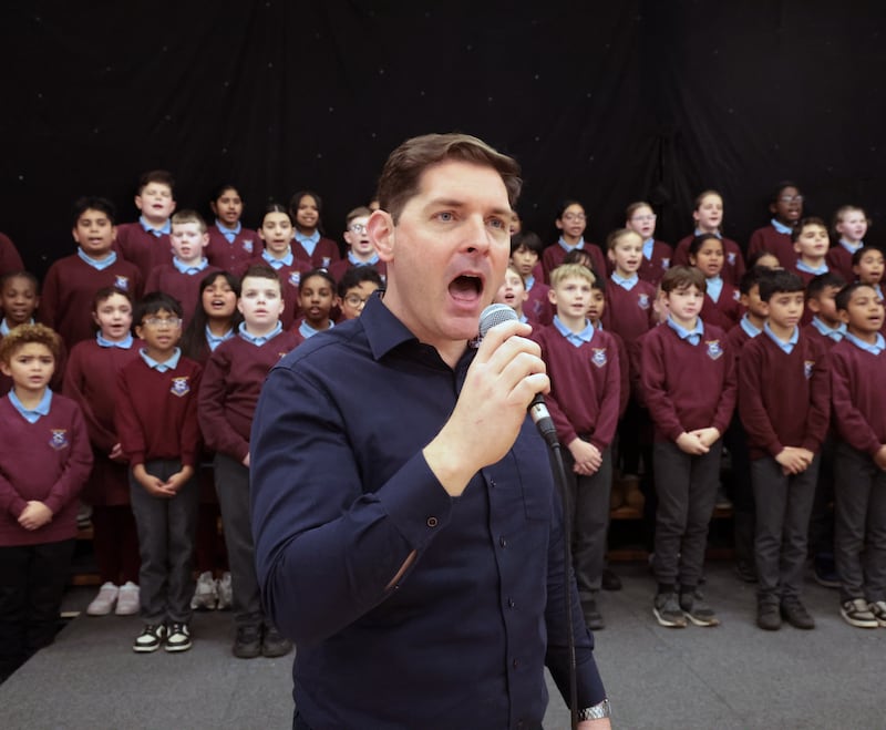 Malachi Cush leads the choir of St Patrick’s Primary School, Dungannon, one of the North’s most diverse primary schools. PICTURE: BRIAN LINCOLN