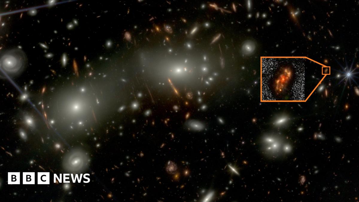 Alaknanda is located near the right centre of the image (see zoomed image in inset). The central portion of the image is dominated by bright galaxies of the Abell 2744 cluster. The cluster acts as a gravitational lens and magnifies (and in some cases, distorts) galaxies lying in the background. Alaknanda is magnified by a factor approximately two, making this faint galaxy easier to detect.