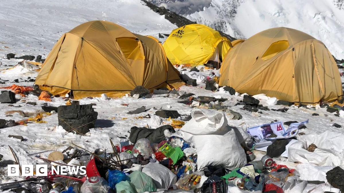 Camp IV on Everest. A cluster of yellow tents surrounded by snow and rubbish.