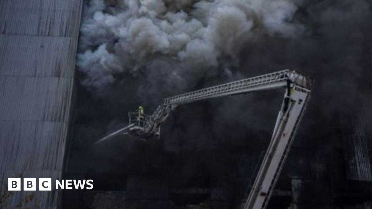 A firefighter tackles a fire in Dnipro