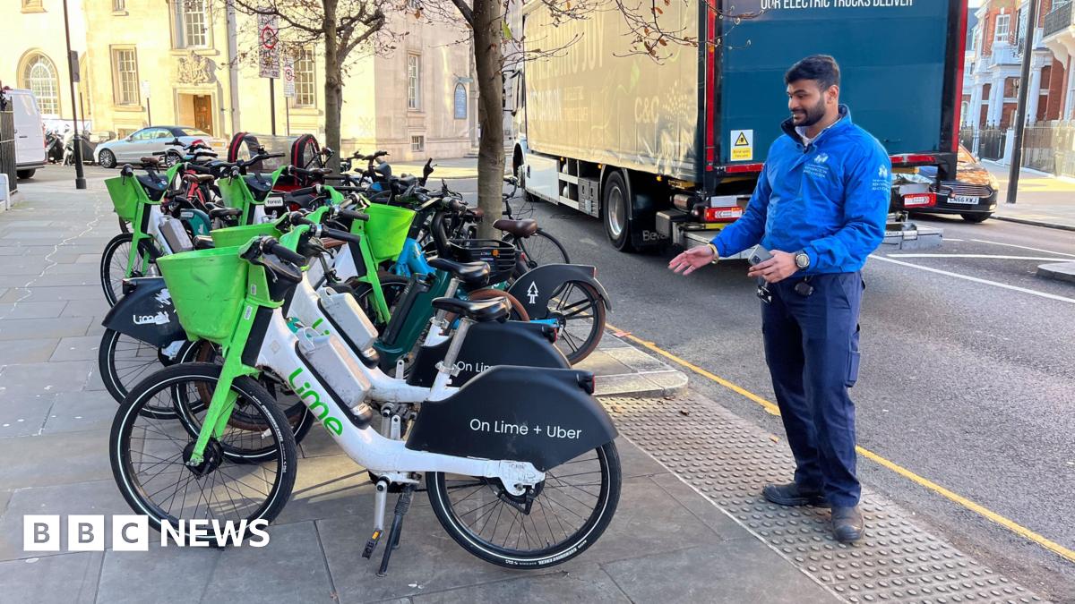Numerous e-bikes are lined up in a row. Some are from Lime, others are from Bolt.