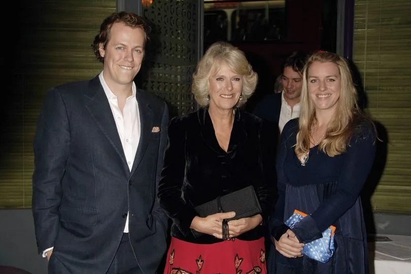 Tom Parker Bowles with his mother Camilla, Duchess of Cornwall and Laura Parker Bowles (R) attend the book launch of 'The Year Of Eating Dangerously' by Tom Parker Bowles, at Kensington Place on October 12, 2006 in London, England.