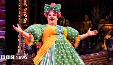 Damian Williams on stage at Sheffield's Lyceum Theatre dressed as a panto dame