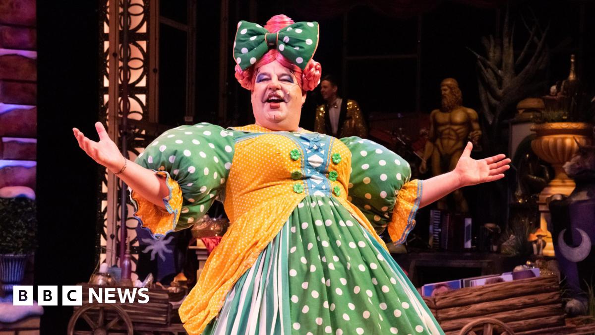 Damian Williams on stage at Sheffield's Lyceum Theatre dressed as a panto dame