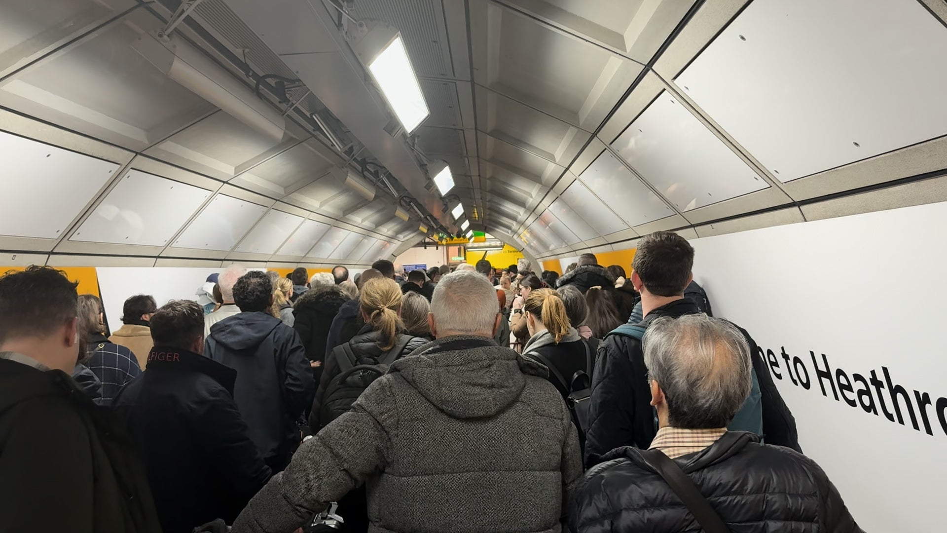 Elizabeth line passengers queuing to exit Heathrow T2/3 station (Zhanna Manukyan/PA)