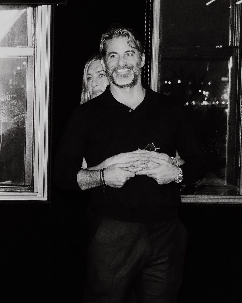 Jennifer Aniston and Jim Curtis embrace in a snap taken at the latter's 50th birthday party, shared on Instagram