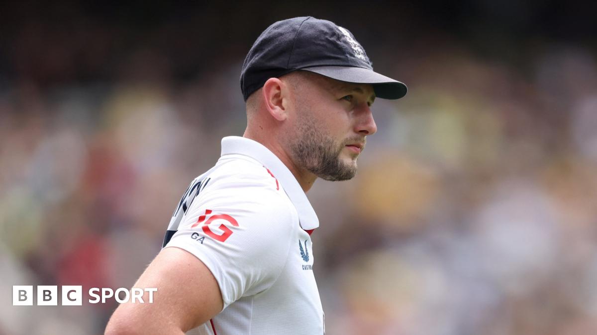 Gus Atkinson looks on