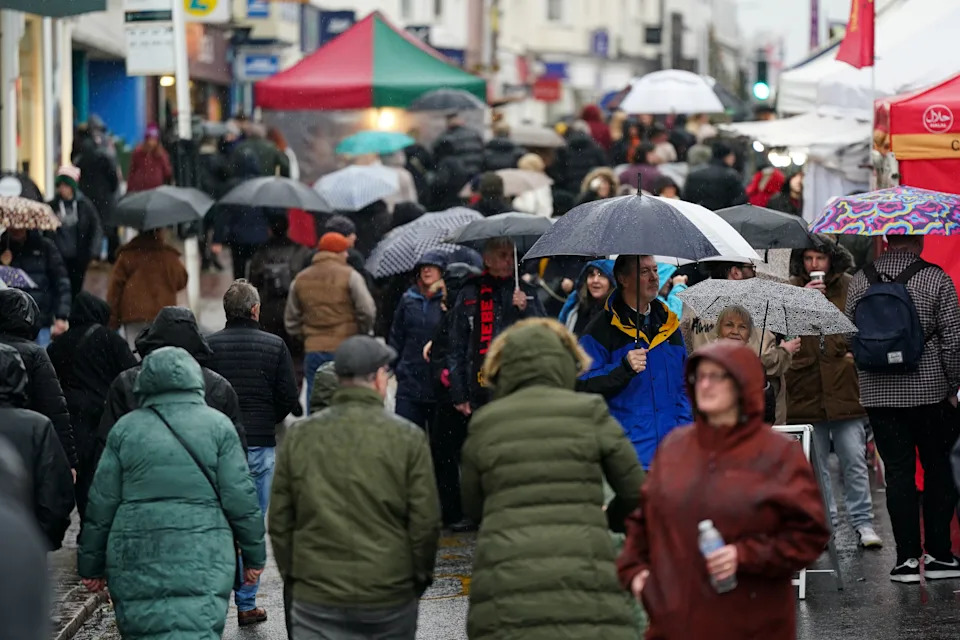 People in Stratford-upon-Avon during wet weather. Picture date: Sunday December 7, 2025. (Photo by Jacob King/PA Images via Getty Images)