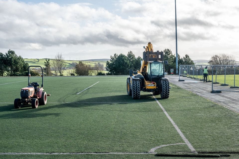 Contractors on site at the artificial pitches at Lisneal College earlier this year. Picture Martin McKeown.