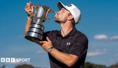 Neergaard-Petersen kisses the Australia Open trophy