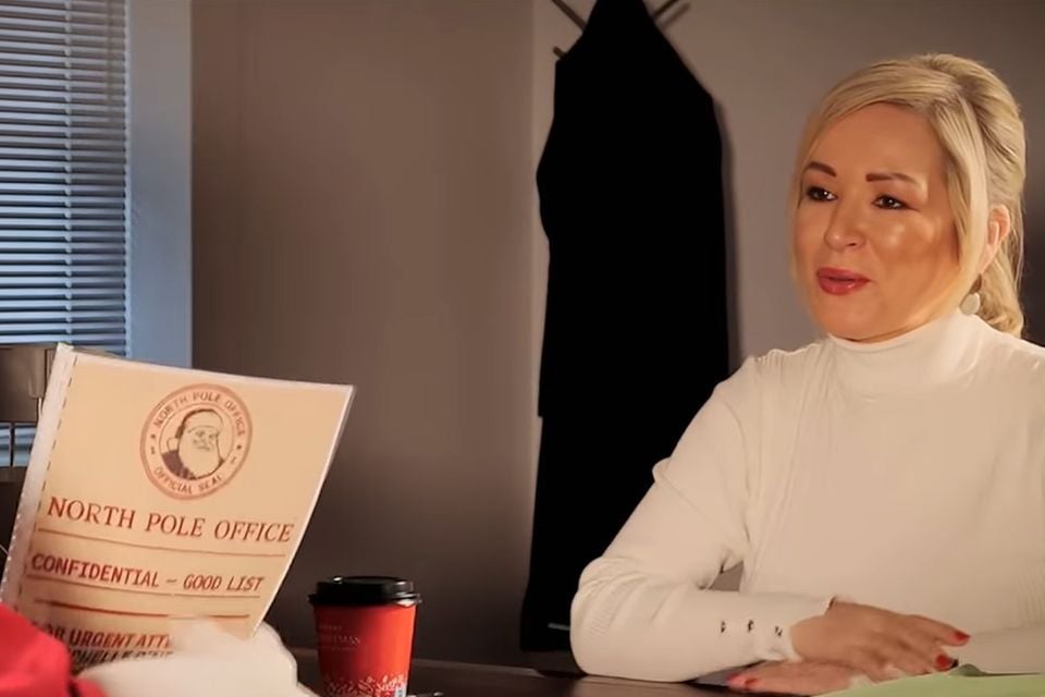 Michelle O'Neill hands over the approved 'nice list' to Santa.