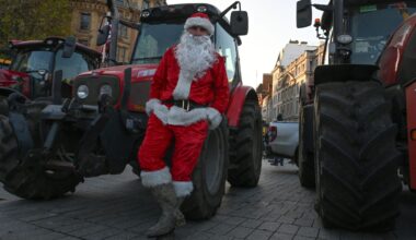 A farmer, wearing Santa costume, is seen as farmers from different regions of the United Kingdom gather with their tractors to protest on budget day, demanding fair reforms in agricultural policies and the reversal of changes to inheritance tax in London on November 26, 2025.