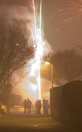 People with fireworks at New Years Eve